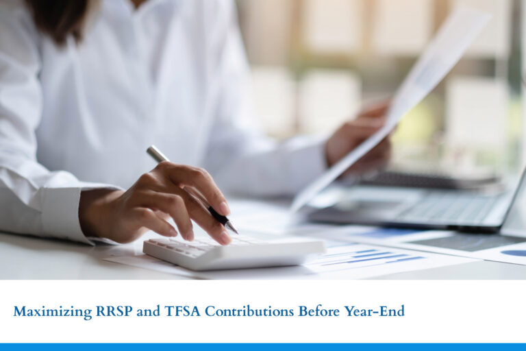 A woman works at a desk with a computer and calculator to do her taxes. MMT Chartered Professional Accountants is ready to help you maximize RRSP and TFSA contributions before the year end